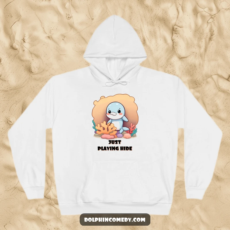 Funny hoodie featuring a mischievous dolphin peeking out from a coral reef, perfect for cozy, playful enjoyment.