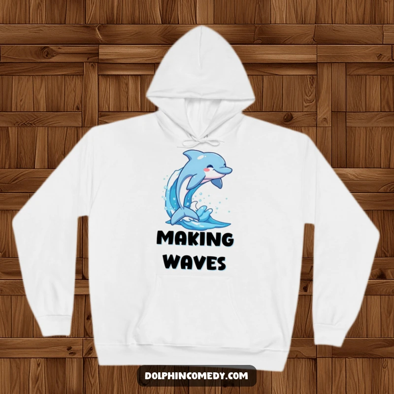 Funny dolphin smiling as it breaches a sparkling blue wave, a cozy hoodie perfect for spreading marine cheer.