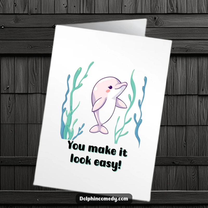 Funny Free Printable Congratulations Card of a dolphin elegantly dancing with extended fins through swaying kelp.