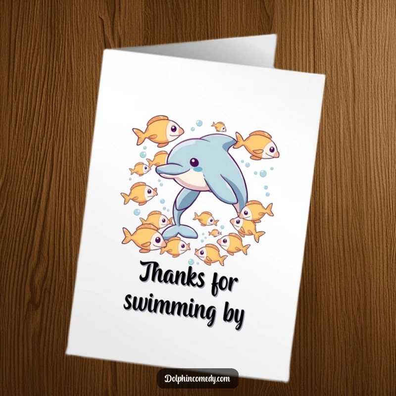 Funny Free Printable Thank You Card: A friendly dolphin interacting with a school of cheerful fish, conveying thanks with a sense of community.