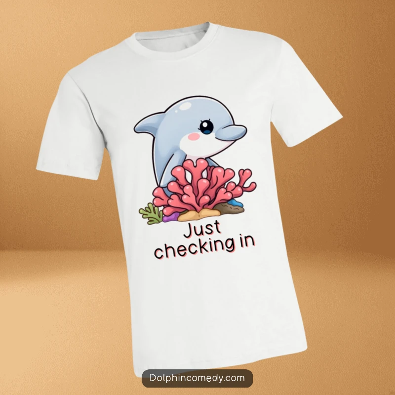 Funny graphic t-shirt featuring a curious dolphin peeking out from behind a vibrant coral formation.