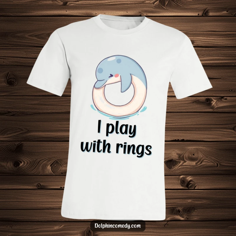 Funny T-Shirt: A charming dolphin playfully nudges a floating ring, showcasing a humorous and joyful marine interaction.